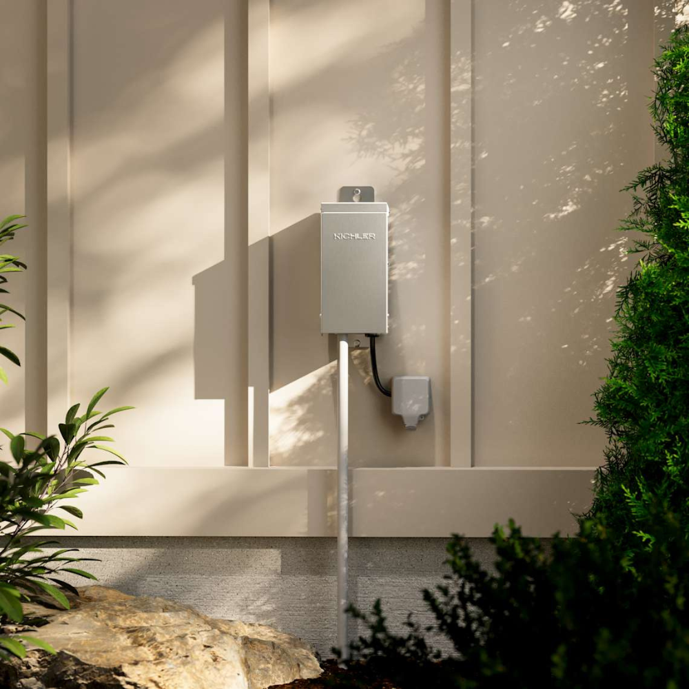 Perspective view of Kichler 15PC75SS transformer displaying mounting flange, pre-punched knockouts for conduit and durable stainless steel housing.