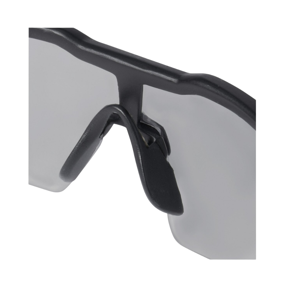 Studio product image of Milwaukee Anti-Scratch Safety Glasses in gray, showing lens curvature, frame detail, and overall lightweight profile.